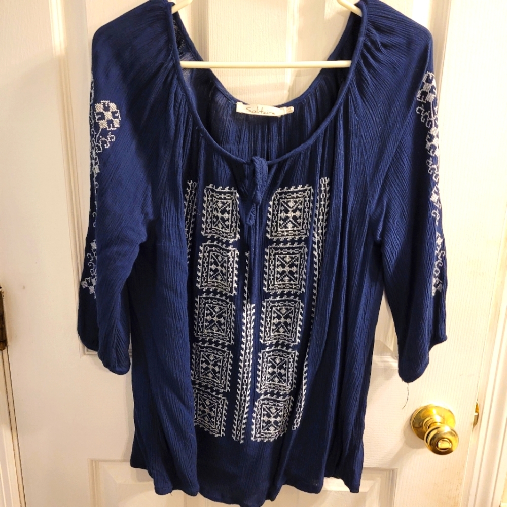 Solitare brand, Navy w White embroidery stitching on front and sleeves. Size L